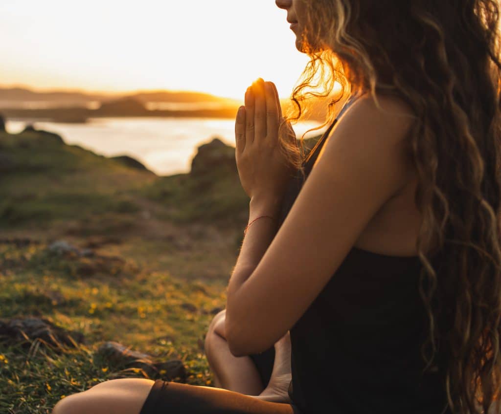 Woman praying in lotus position